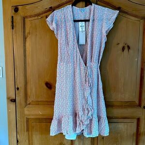 Brand new!!Adorable wrap floral dress.